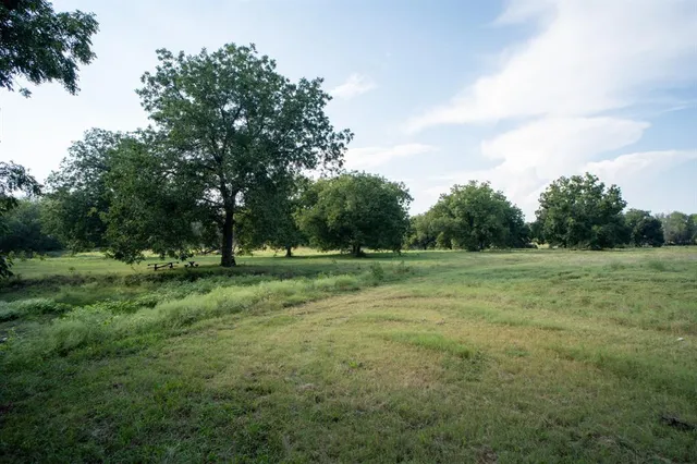 a view of a golf course with a lake
