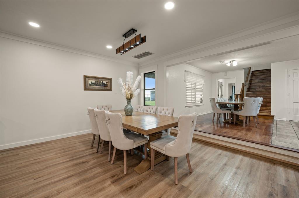 10902 Clear Creek Road West Sanger, TX 76266 - Photo 9 of 40 Dining room featuring light wood-style floors, crown molding, stairway, and recessed lighting
