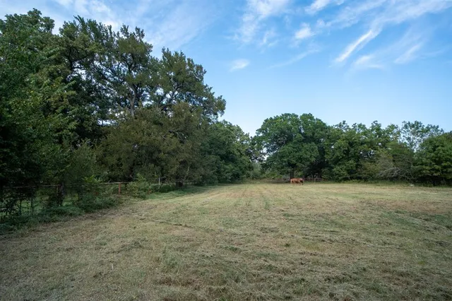 a view of a backyard with sitting area