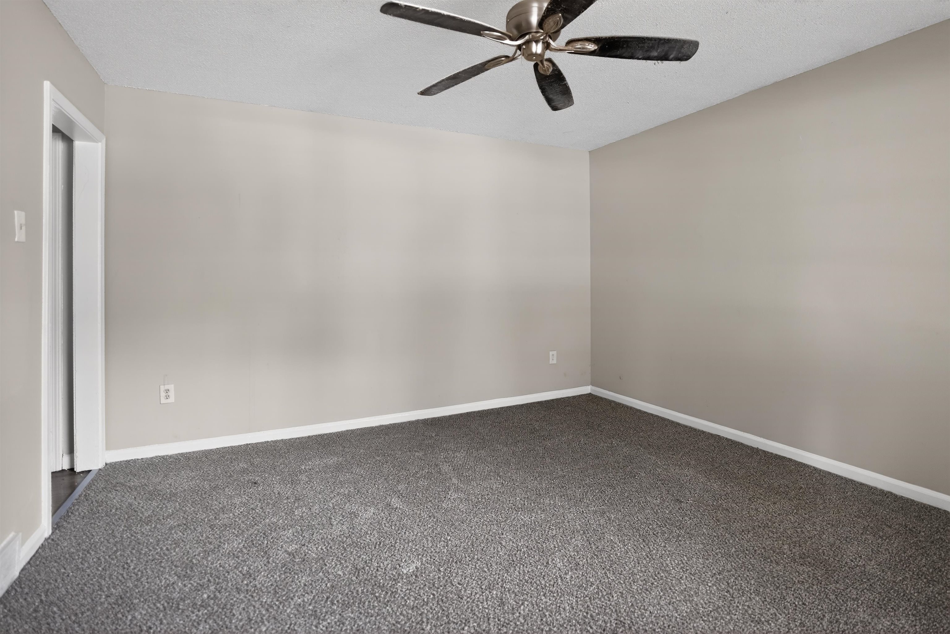 4530 Spring Valley Drive Memphis, TN 38128 - Photo 8 of 15 Spacious room featuring neutral wall tones and plush grey carpeting