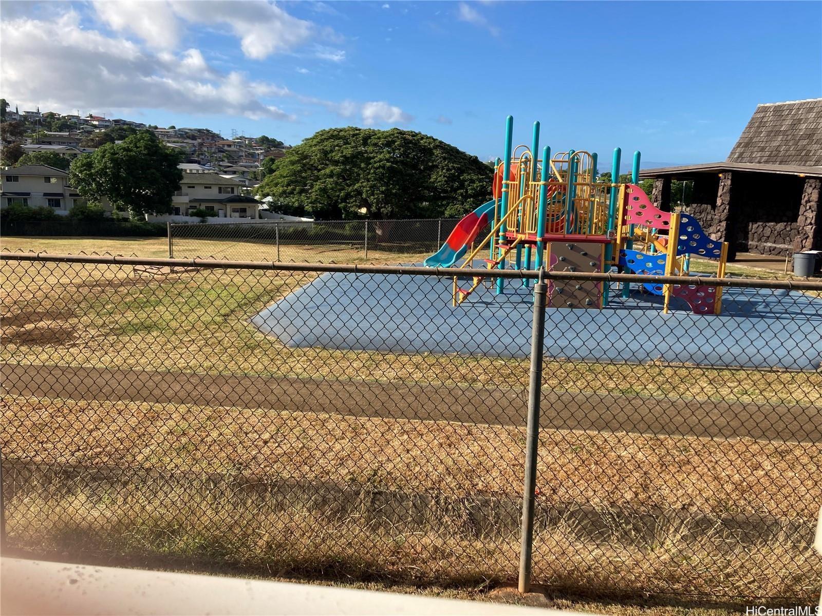 4280 Salt Lake Boulevard, Unit C13 Honolulu, HI 96818 - Photo 16 of 16 a view of swimming pool with a yard