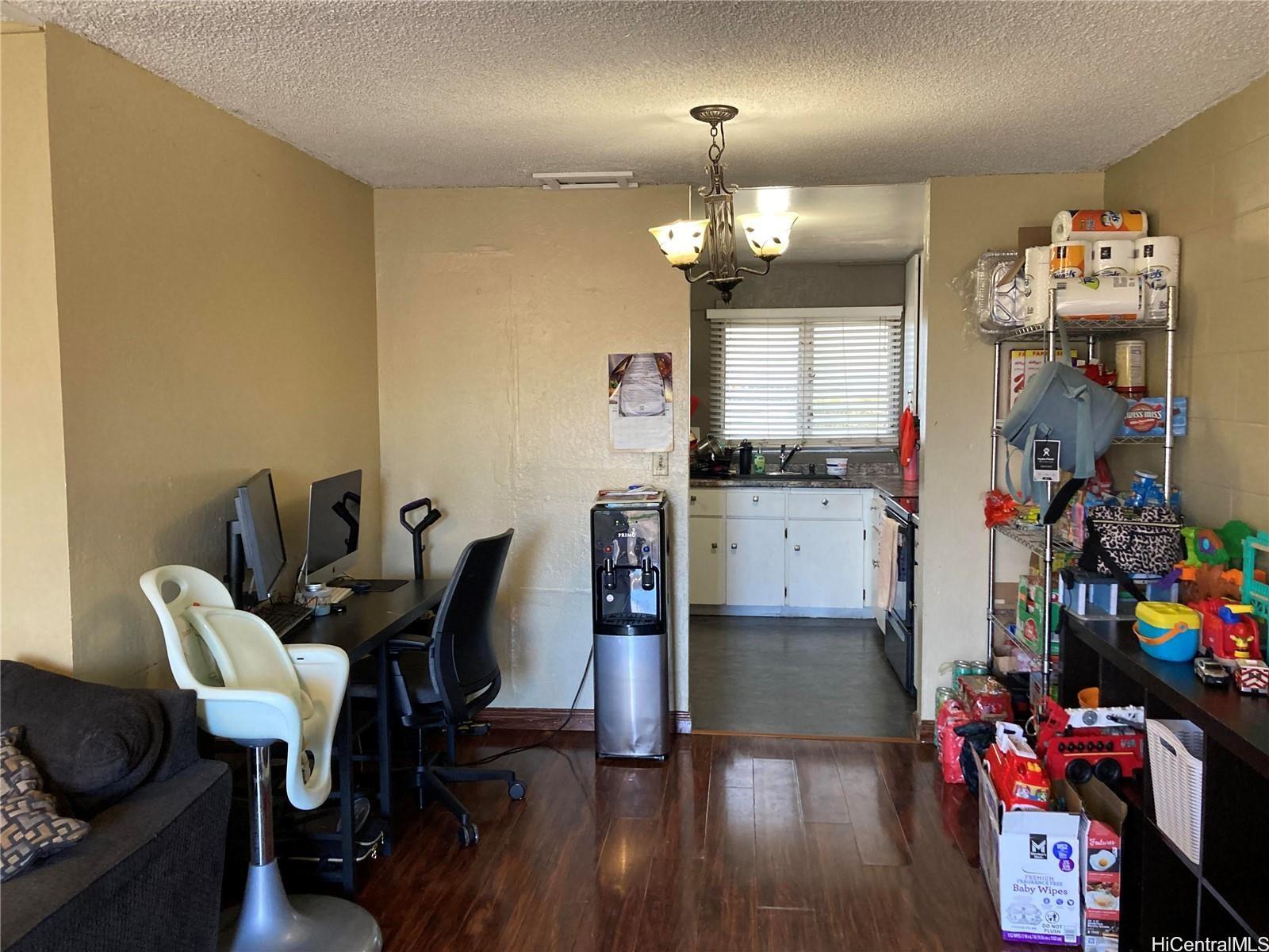 4280 Salt Lake Boulevard, Unit C13 Honolulu, HI 96818 - Photo 2 of 16 a view of a dining room with furniture and wooden floor