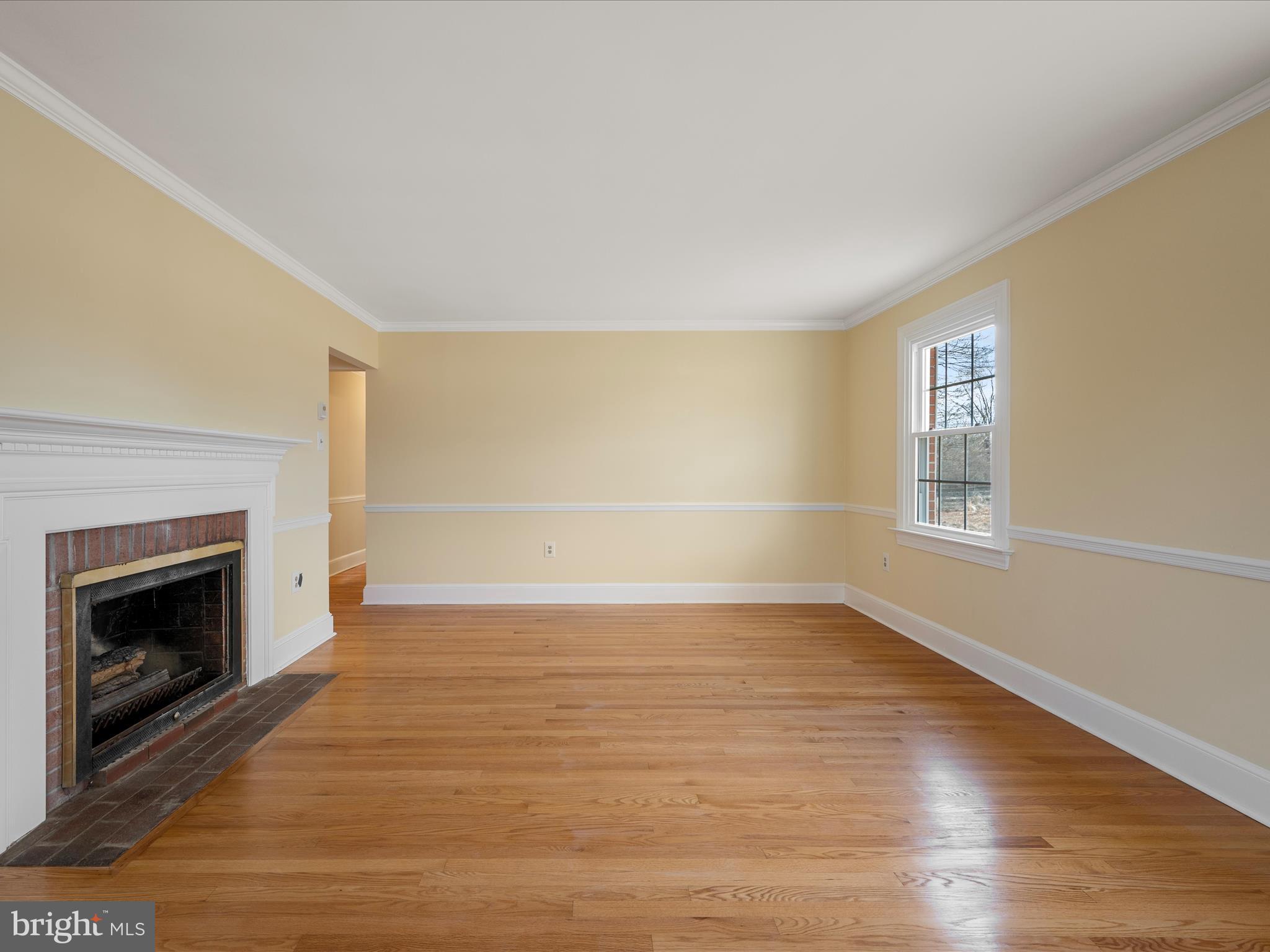 237 Summerville Road Boyce, VA 22620 - Photo 18 of 53 a view of an empty room with wooden floor fireplace and a window