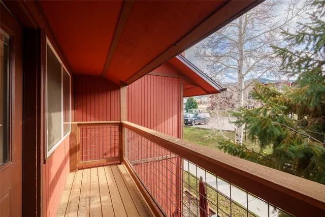 a view of balcony with wooden floor