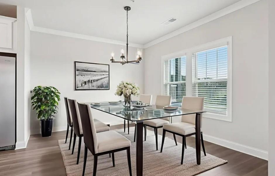 6060 Molo Lane Cumming, GA 30041 - Photo 2 of 14 a view of a dining room with furniture window and wooden floor