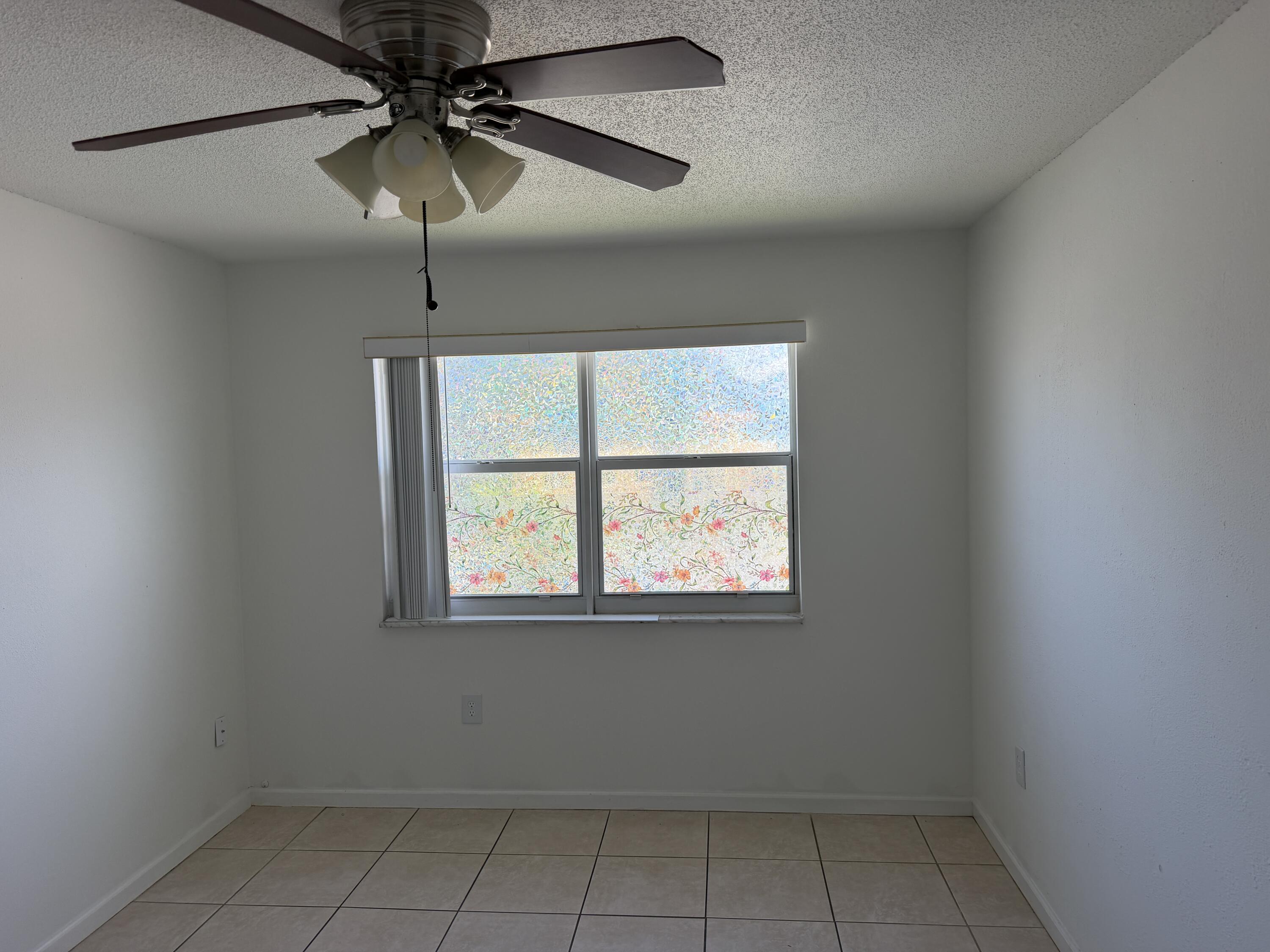 506 Davis Road, Unit 70 Palm Springs, FL 33461 - Photo 21 of 25 an empty room with a window