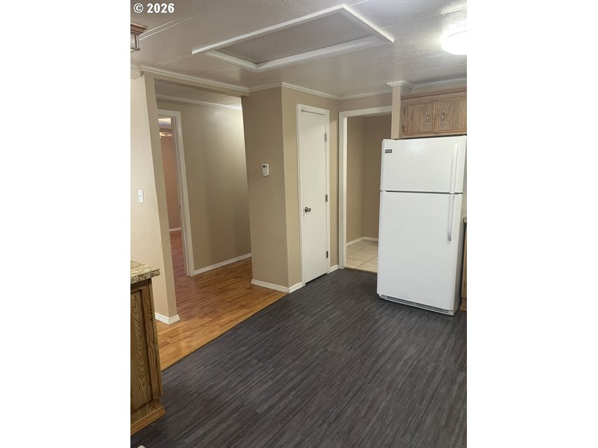 5660 Daisy Street, Unit 31 Springfield, OR 97478 - Photo 44 of 44 a view of a hallway with wooden floor
