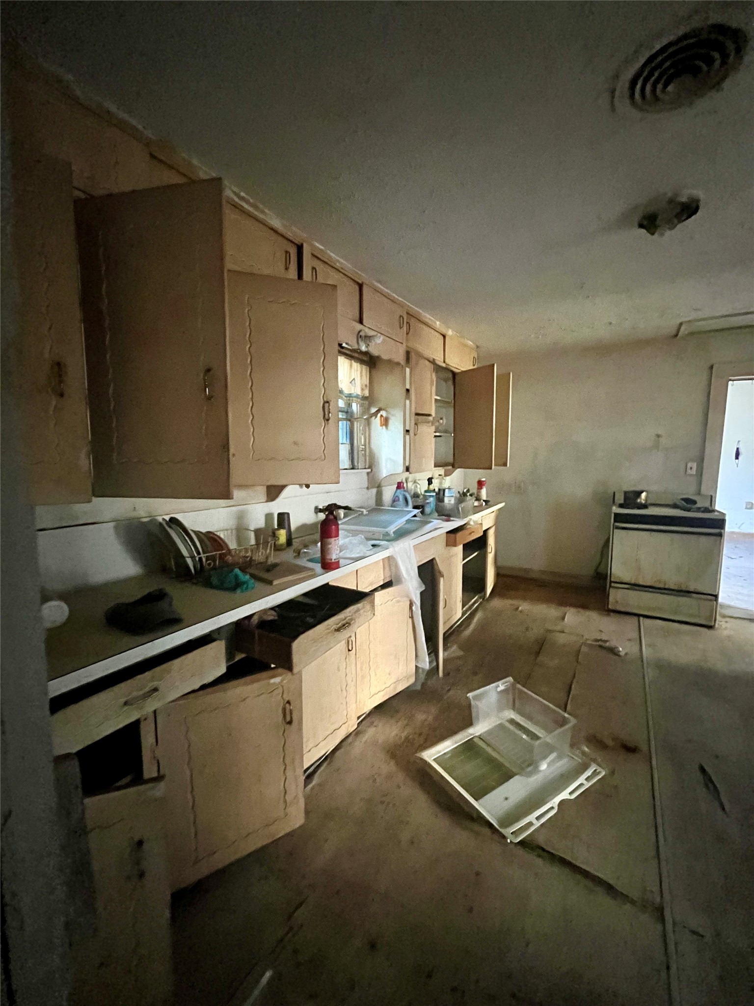 5845 Darling Street Houston, TX 77007 - Photo 9 of 27 a kitchen with a sink stove and cabinets