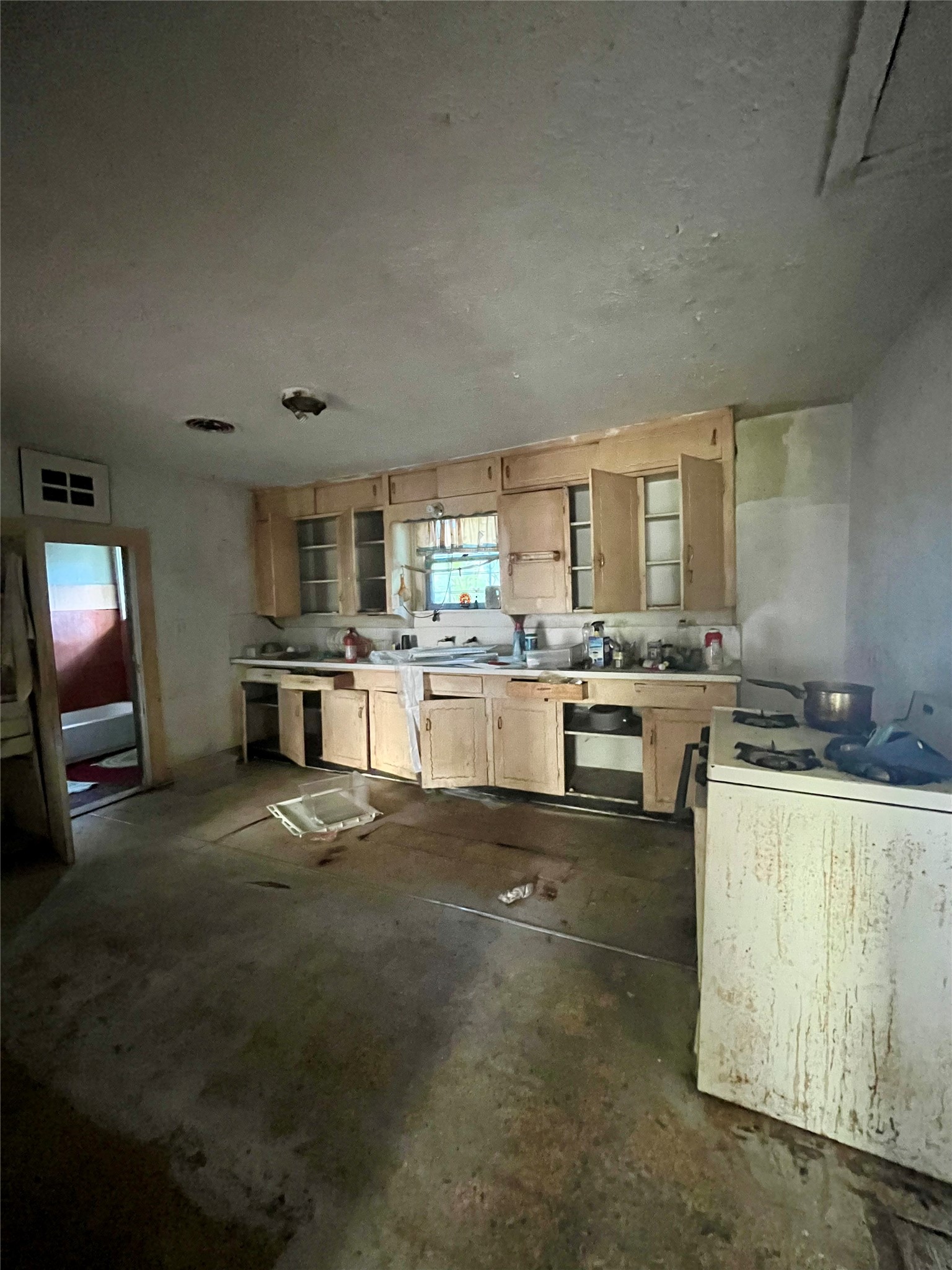 5845 Darling Street Houston, TX 77007 - Photo 10 of 27 a kitchen with stainless steel appliances granite countertop a stove top oven a sink and white cabinets