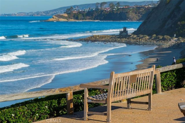 a view of a chair and table on the roadside