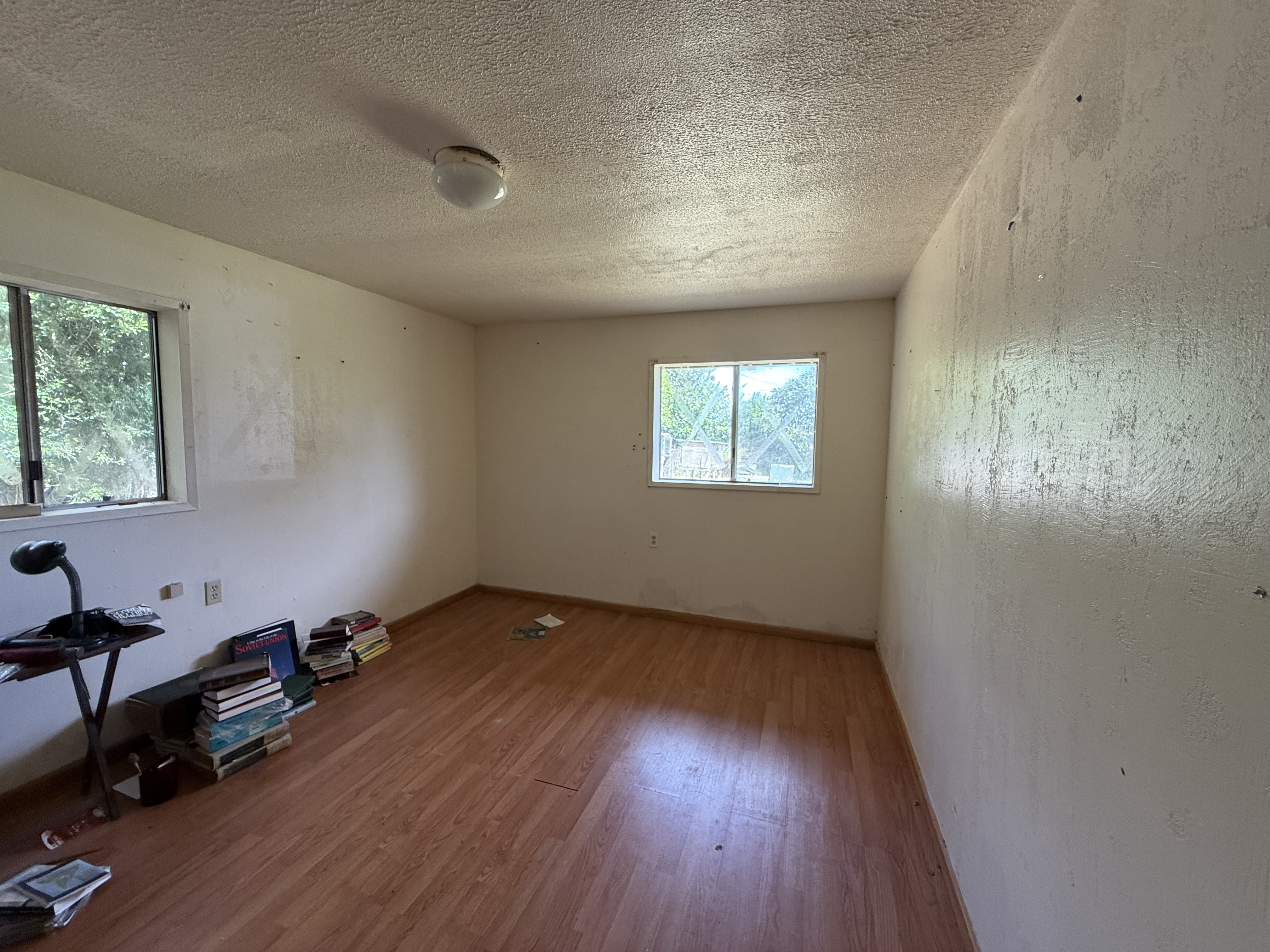 64-5231 White Road Kamuela, HI 96743 - Photo 14 of 15 wooden floor in an empty room with a window