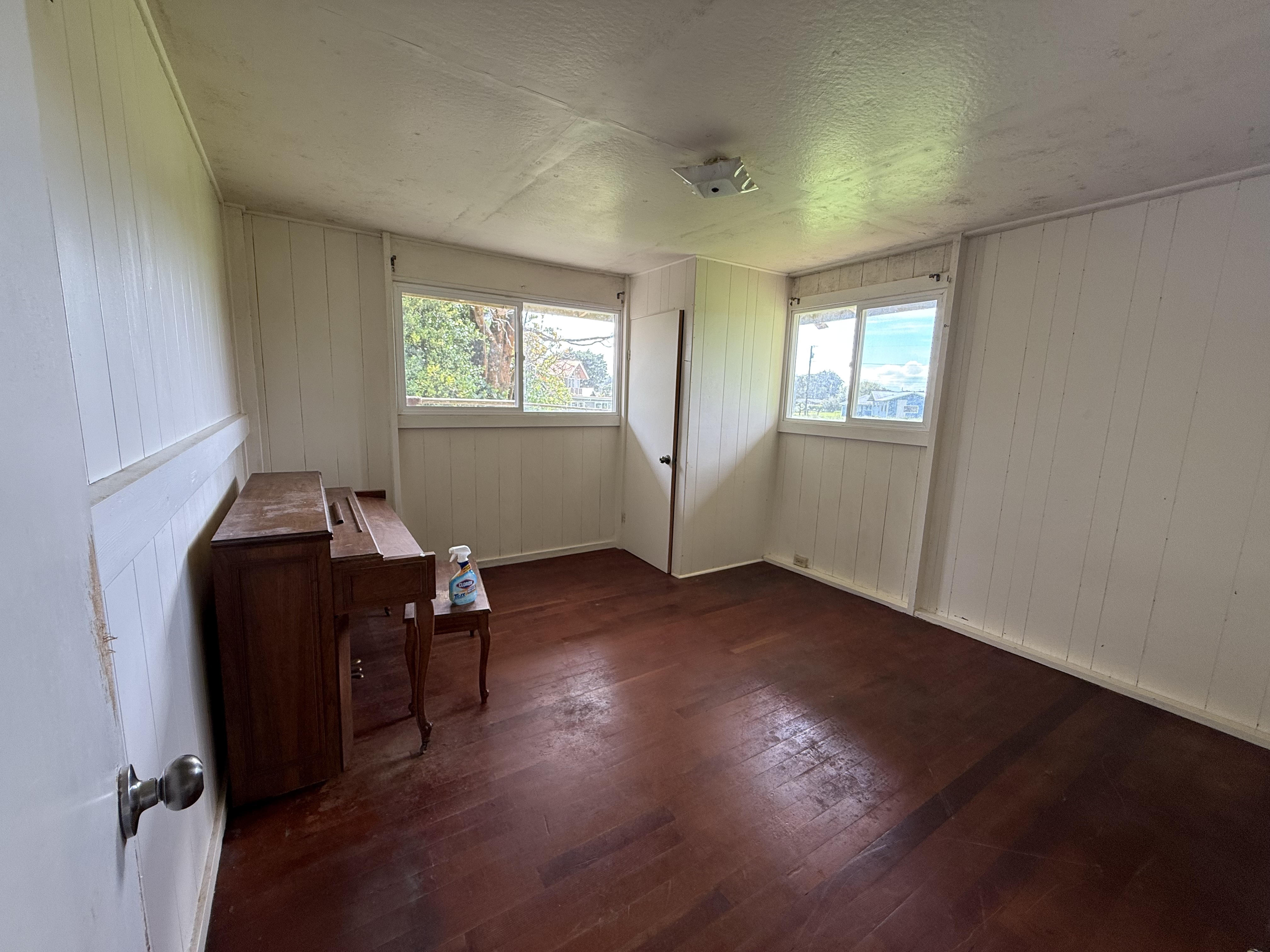 64-5231 White Road Kamuela, HI 96743 - Photo 6 of 15 an empty room with wooden floor and windows