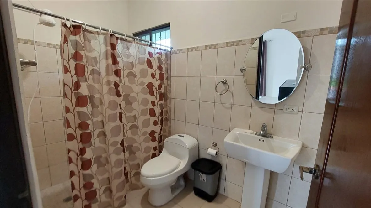 13 Masaya Highway Schenectady, OS 12345 - Photo 11 of 12 a bathroom with a toilet sink and shower