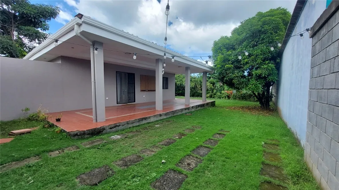 13 Masaya Highway Schenectady, OS 12345 - Photo 5 of 12 a front view of a house with a yard