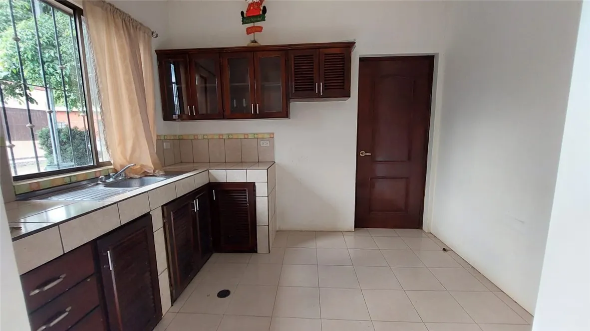 13 Masaya Highway Schenectady, OS 12345 - Photo 8 of 12 a kitchen with a sink and a stove