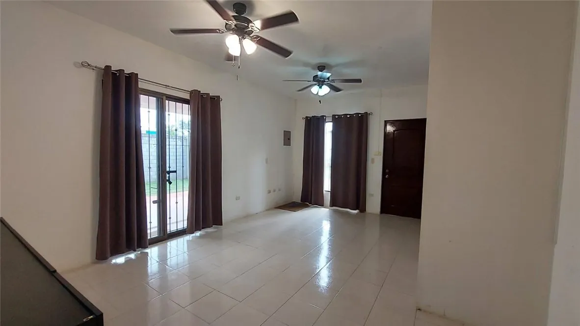 13 Masaya Highway Schenectady, OS 12345 - Photo 10 of 12 a view of an empty room with a fan