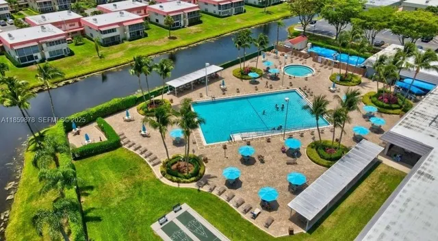 an aerial view of an chairs and umbrellas
