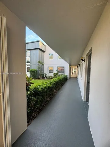a view of a back yard and porch