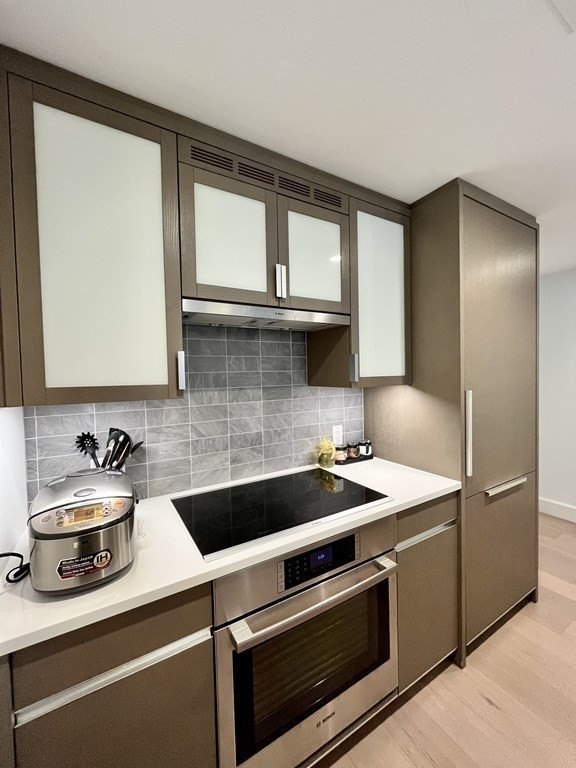 100 Lovejoy Wharf, Unit 8M Boston, MA 02114 - Photo 12 of 37 a kitchen with a sink and a refrigerator