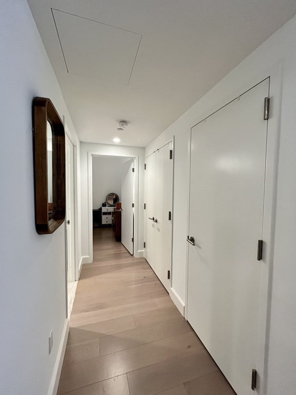 100 Lovejoy Wharf, Unit 8M Boston, MA 02114 - Photo 14 of 37 a view of a hallway view with living room
