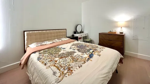 a bedroom with a bed and a closet