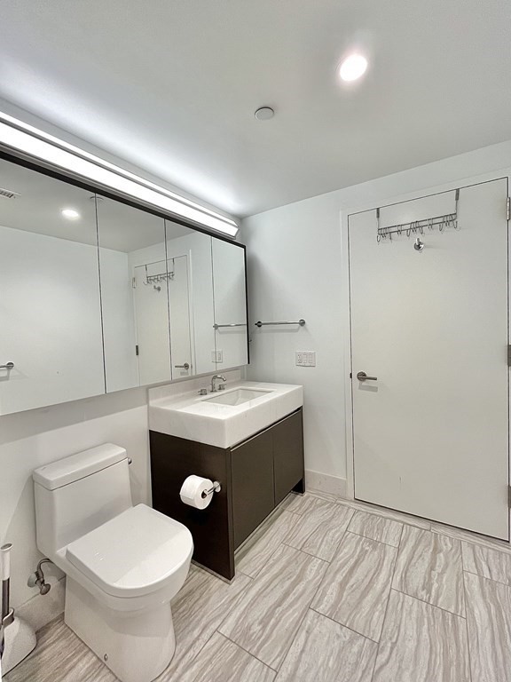 100 Lovejoy Wharf, Unit 8M Boston, MA 02114 - Photo 20 of 37 a bathroom with a sink toilet and shower