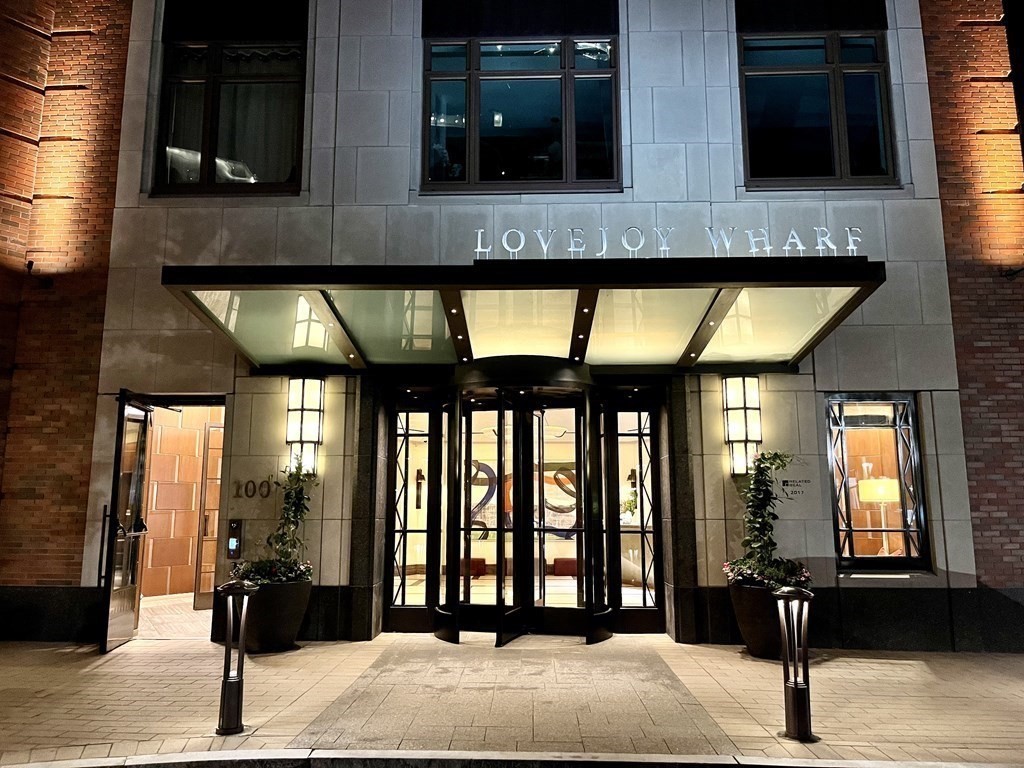 100 Lovejoy Wharf, Unit 8M Boston, MA 02114 - Photo 2 of 37 a building with a lot of windows