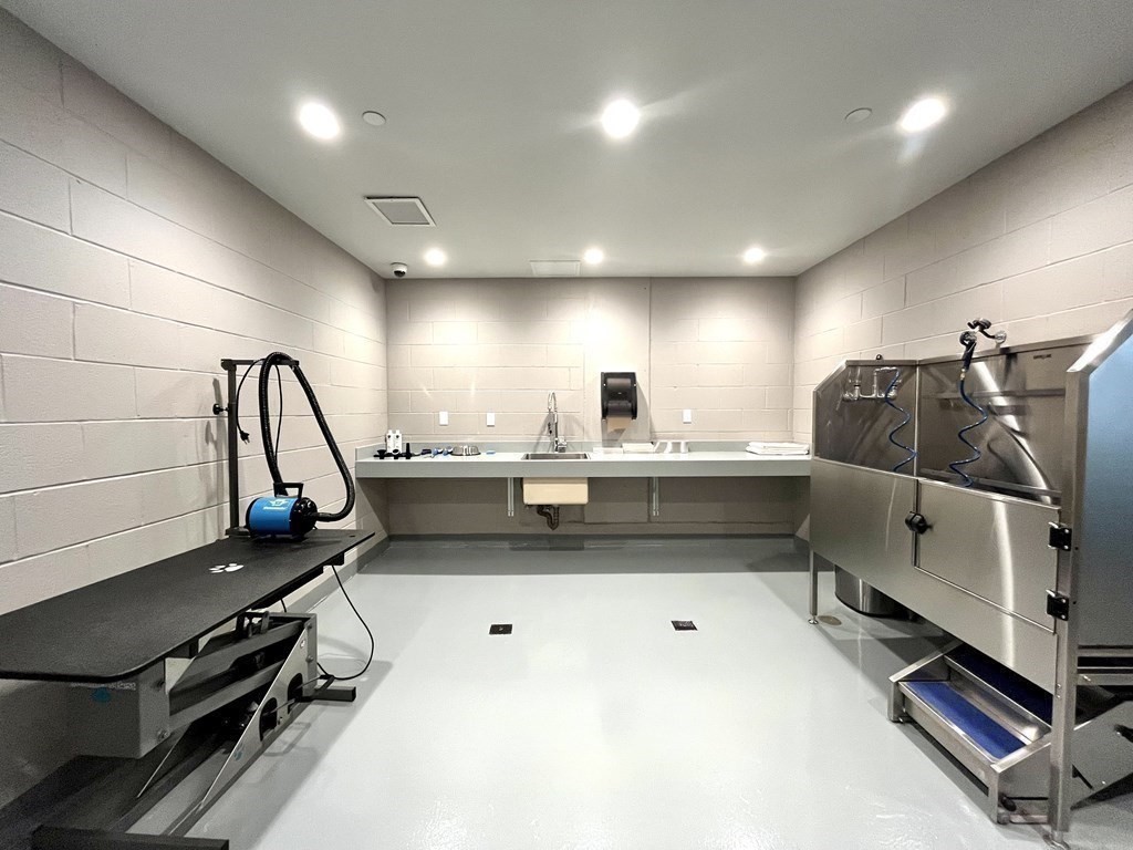 100 Lovejoy Wharf, Unit 8M Boston, MA 02114 - Photo 24 of 37 a kitchen with a sink stainless steel appliances and cabinets