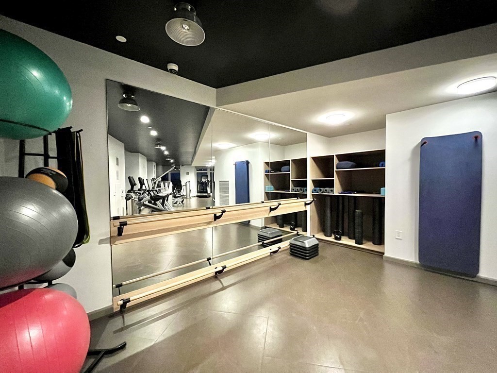 100 Lovejoy Wharf, Unit 8M Boston, MA 02114 - Photo 27 of 37 a view of a room with gym equipment
