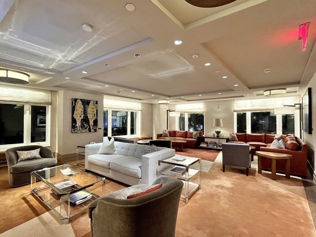 100 Lovejoy Wharf, Unit 8M Boston, MA 02114 - Photo 30 of 37 a living room with furniture and a large window