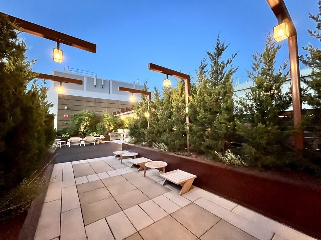 100 Lovejoy Wharf, Unit 8M Boston, MA 02114 - Photo 36 of 37 a outdoor space with lots of trees in the background