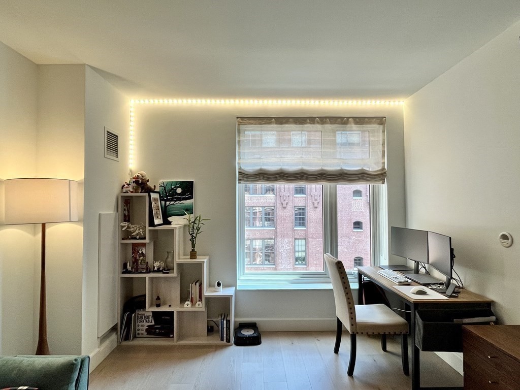 100 Lovejoy Wharf, Unit 8M Boston, MA 02114 - Photo 8 of 37 a workspace with furniture and window
