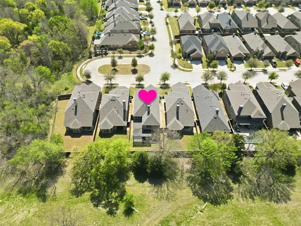 an aerial view of residential house with outdoor space and swimming pool