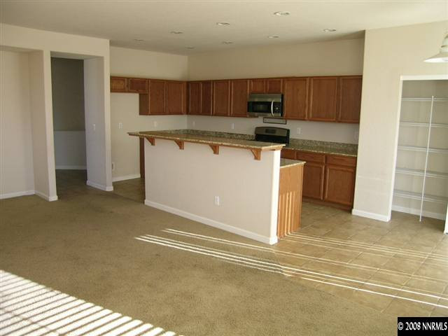 9045 Andraste Way Reno, NV 89506 - Photo 4 of 8 a kitchen with a sink and cabinets