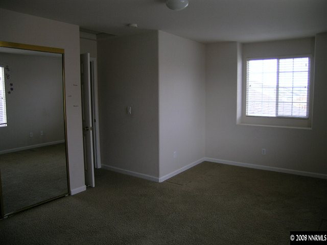 9045 Andraste Way Reno, NV 89506 - Photo 7 of 8 an empty room with a empty space and window