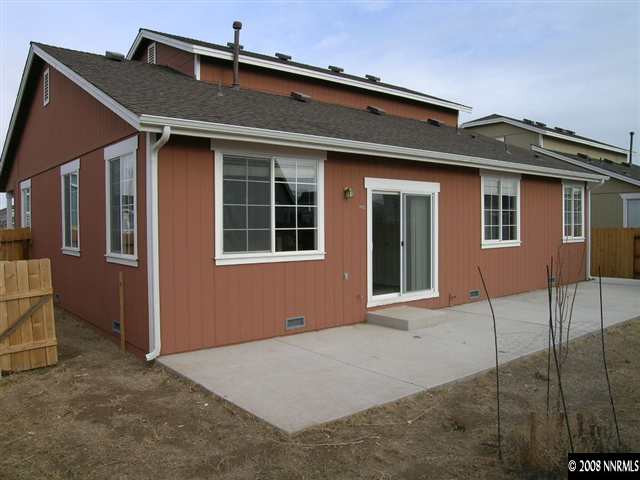 9045 Andraste Way Reno, NV 89506 - Photo 8 of 8 a front view of a house with a garage