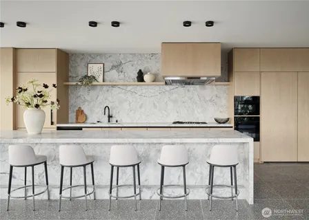 a kitchen with cabinets and chairs