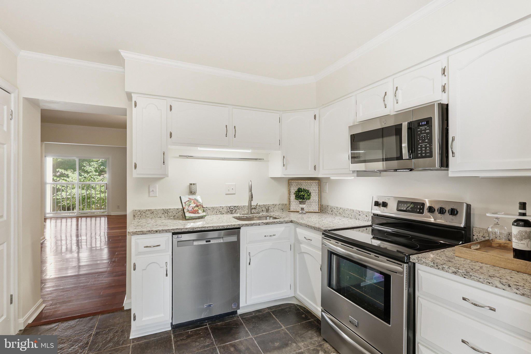 1651 Valencia Way Reston, VA 20190 - Photo 17 of 66 Kitchen with painted cabinets