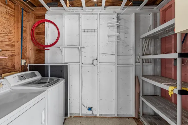 an aerial view of a house with swimming pool and garden