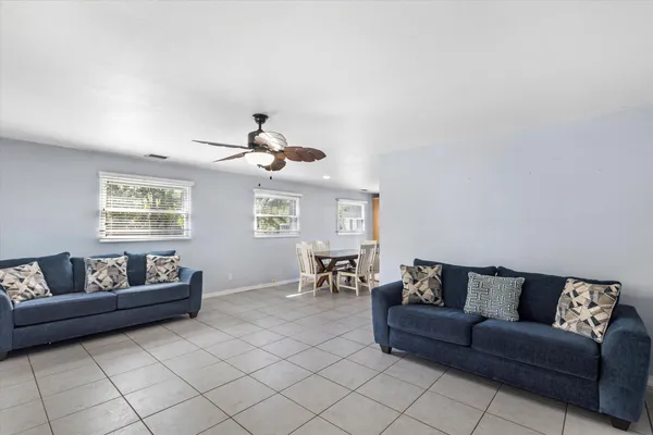 a living room with furniture and a window