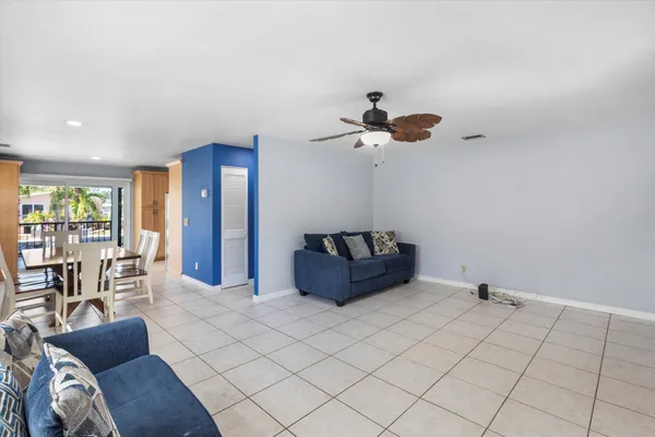 a view of a dining room with furniture and window