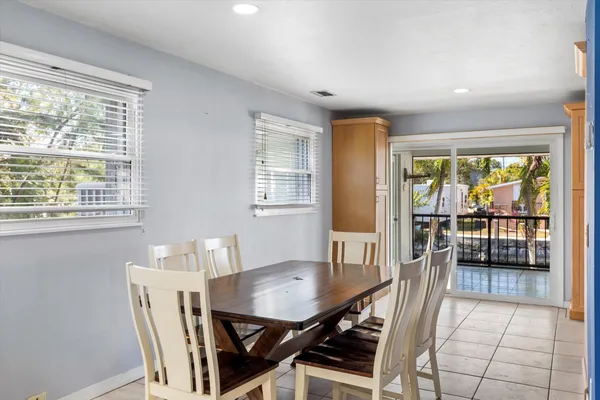 a kitchen with stainless steel appliances granite countertop wooden cabinets stove top oven and sink
