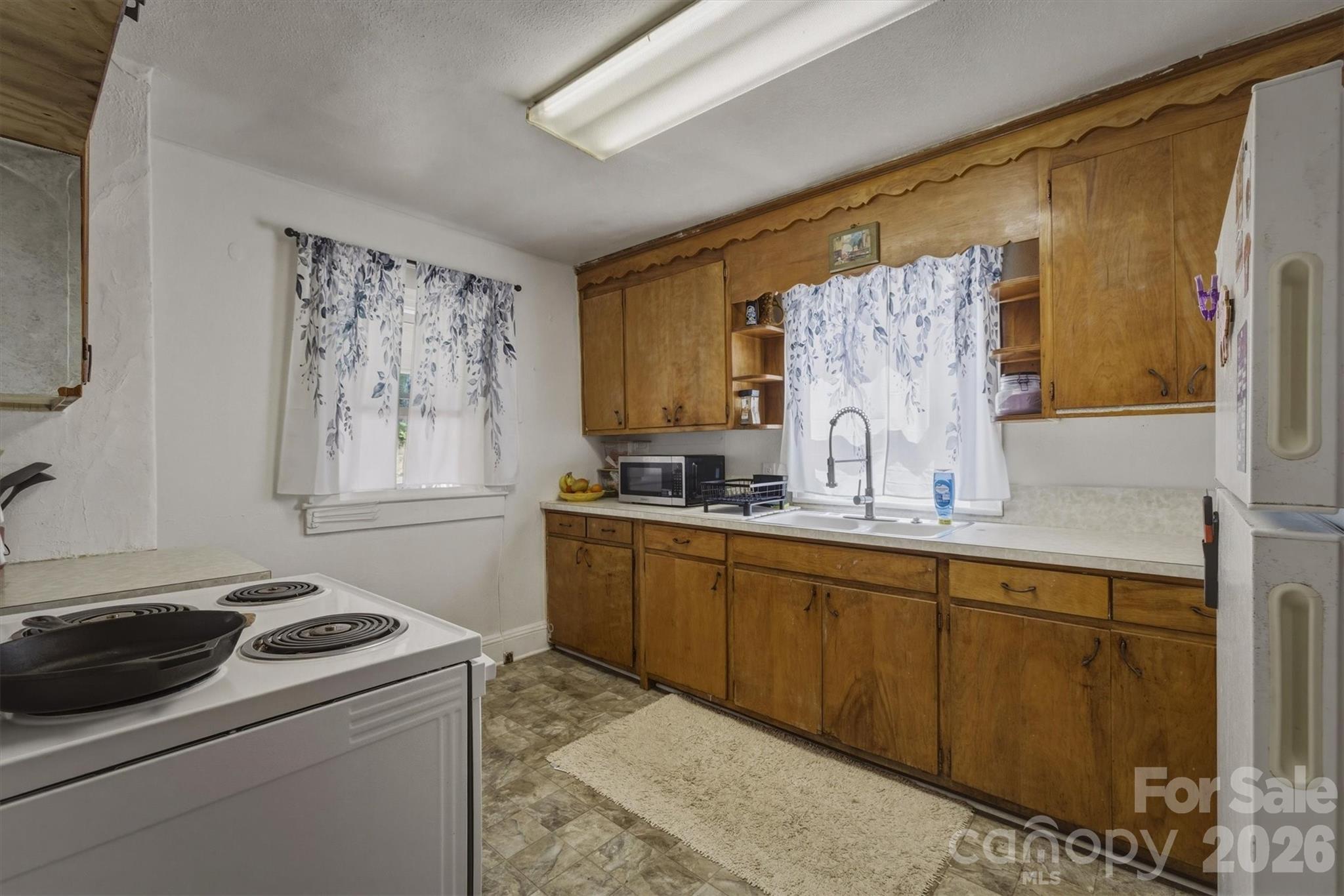 117 3rd Avenue Southwest Hickory, NC 28602 - Photo 12 of 21 a kitchen with a stove and a sink