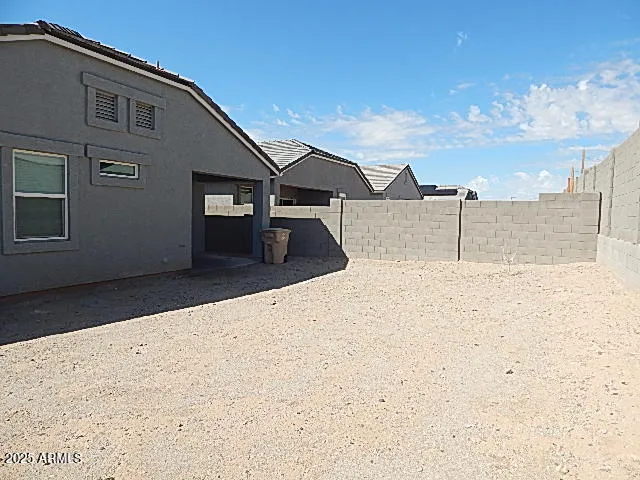 a view of a room with cabinet and refrigerator