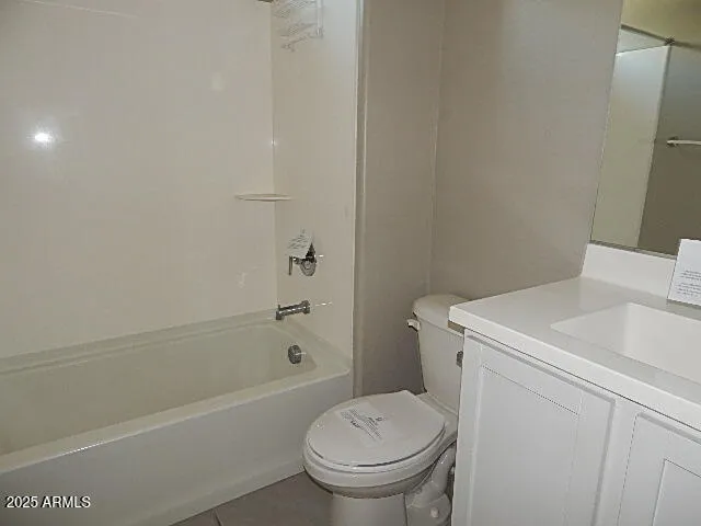 a bathroom with a sink a toilet and bathtub