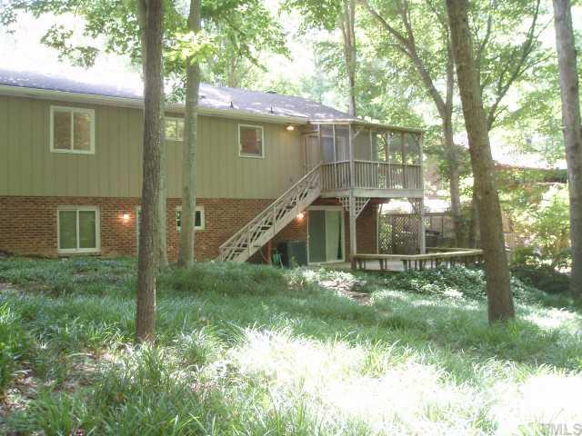 4923 Oak Park Road Raleigh, NC 27612 - Photo 3 of 12 SPACIOUS IN EVERY WAY! You'll love the very nature of this lovely lowmaintenance fenced yard....Enjoy the beauty of nature...screened porch....Deck with built-in seating has access to huge recreation room w/fireplace wood stove insert! Cozy Comfort!