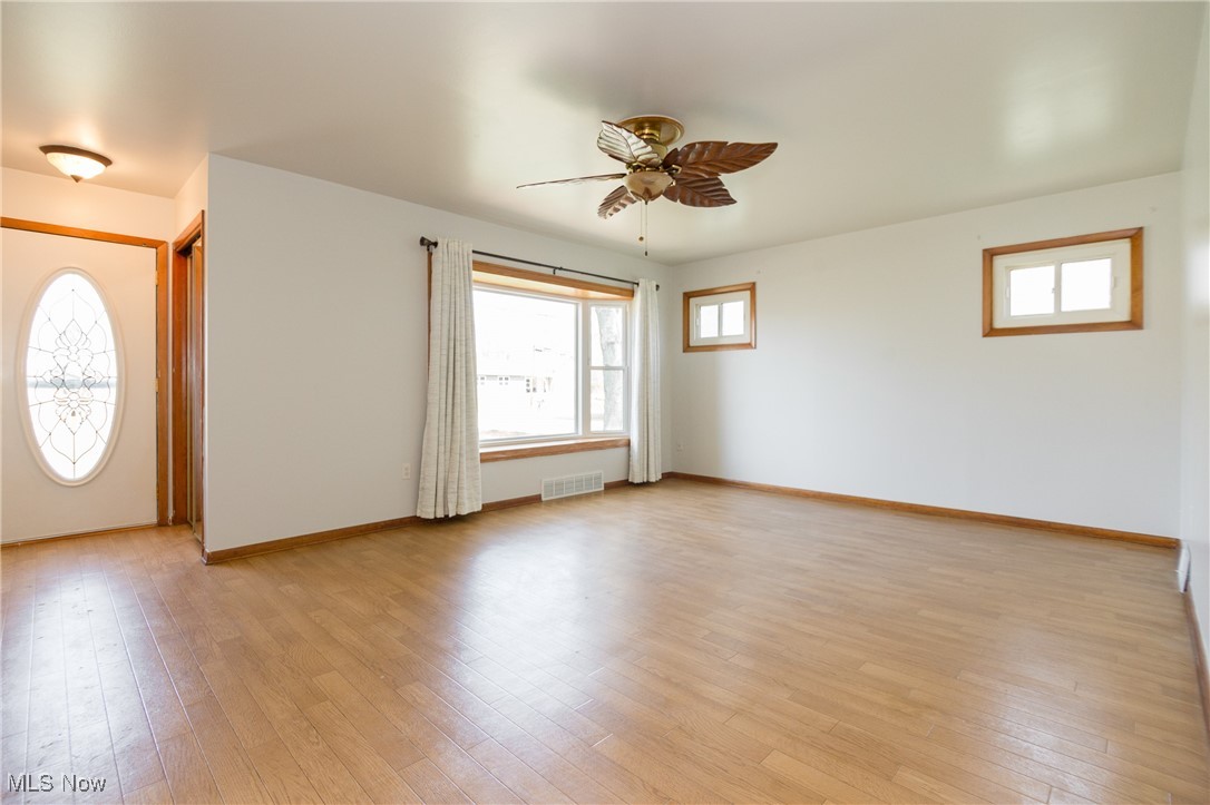 32575 Bagley Road North Ridgeville, OH 44039 - Photo 14 of 30 Entrance foyer featuring visible vents, light wood-type flooring, a ceiling fan, and baseboards