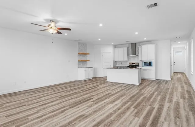 a view of kitchen with wooden floor and window