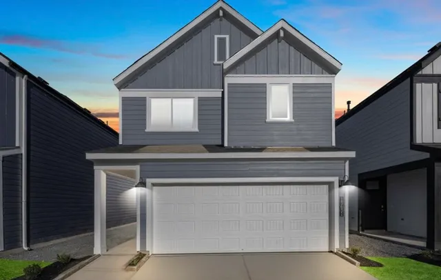 a front view of a house with yard