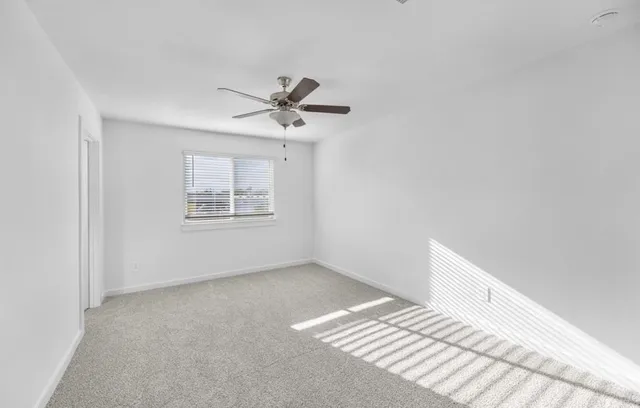 a view of a big room with wooden floor and closet